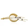 Gold brooch comet tail with four sapphires.