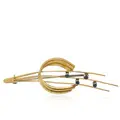 Gold brooch comet tail with four sapphires.