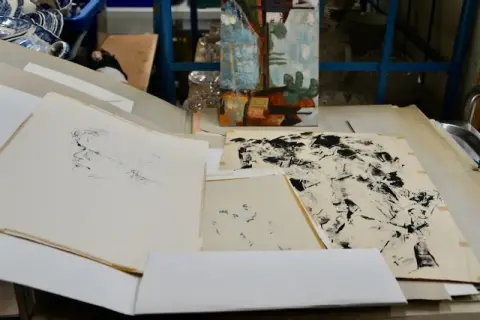 3 folders with art prints