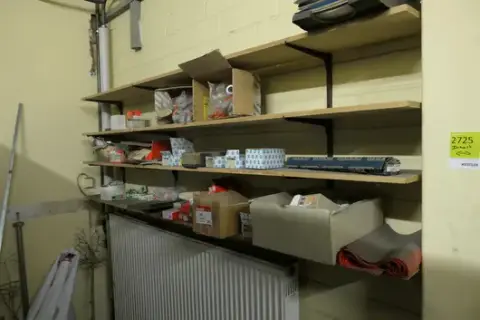 Mixed lot of construction, electrical and DIY materials, including small parts and storage boxes