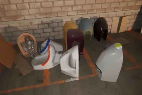 Lot of sanitary ceramics, including wall-mounted toilets, various colours