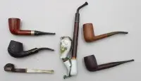7 разных трубок, некоторые с клеймом, 1 фарфоровая, ок. д. 24,5 см