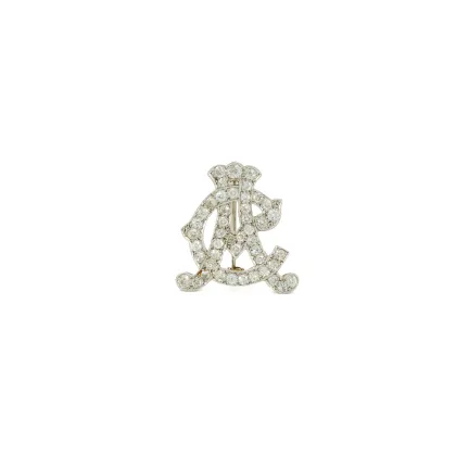 Broche met initialen 'AC'