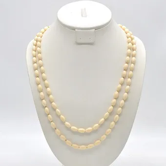 Bone pearl necklace, oval pearls, individually knotted, with clasp, circa 1950.