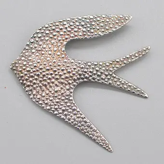 PAUL WUNDERLICH (1927-2010). "SILBERVOGEL", kunstenaarssieraad, hanger en broche, sterling zilver, gesigneerd en genummerd, jaren 1990.