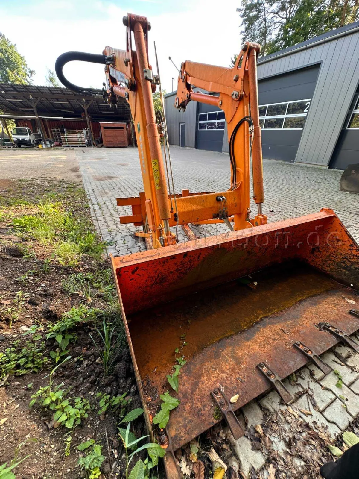 1 front loader with universal bucket and pallet fork