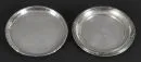 Dessous de verre, 2 pièces – argent 800, env. 155 g, bords avec différents décors, D= 14 cm