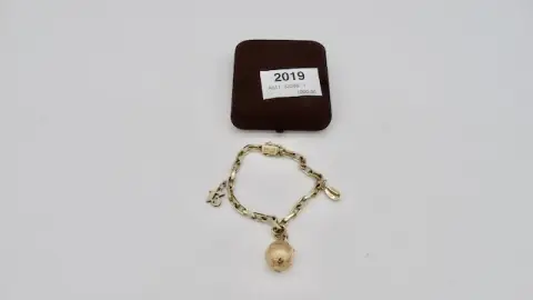 1 браслет с различными подвесками из золота 585