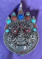 Large Mahakala pendant, probably Tibet/India, silver-plated, with coral, turquoise, lapis lazuli etc., H 8 cm, W 5 cm