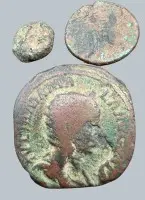 3 antique coins, largest probably Roman, imperial period, all in poor condition