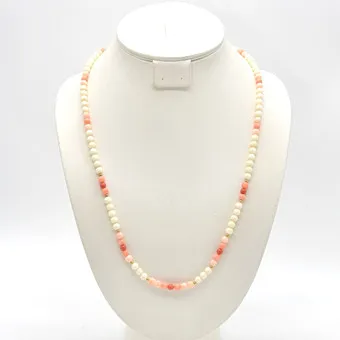 Pearl necklace made of angel skin coral, endless strand, pink and white, gold-plated beads, 20th century.