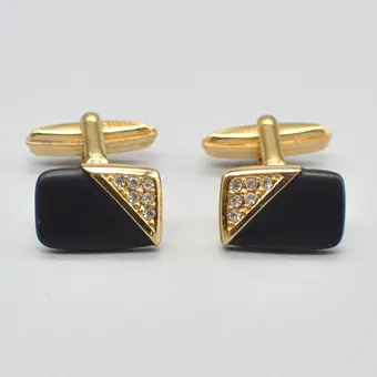 CHRISTIAN DIOR. DESIGNER CUFFLINKS, ONYX, RHINESTONES, GILT SETTING, CIRCA 1950, WITH ORIGINAL PACKAGING.