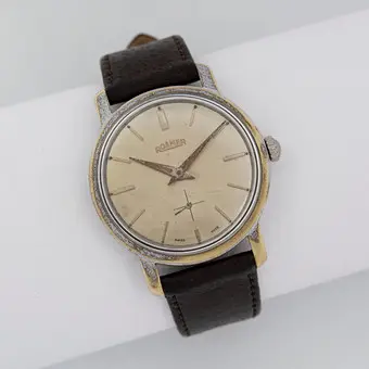 ROAMER, BREVETÉ, HERRENARMBANDUHR MIT HANDAUFZUG, EDELSTAHGEHÄUSE, SWISS MADE, SCHWARZES LEDERBAND, UM 1950ER JAHRE.