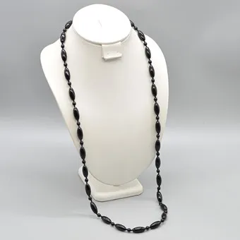 Glass bead necklace, round and oval beads, handmade, screw clasp, circa 1950.