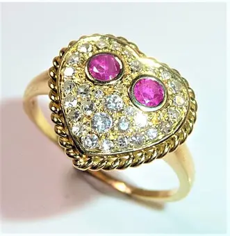 Anillo de oro 750, 0,50 ct brillantes + 0,20 ct rubíes.