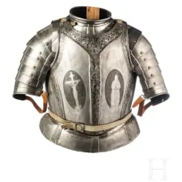 Etched cuirass and shoulder defence, German, circa 1600, with later etched decoration