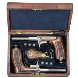 Et par underhammer-perkussionspistoler i kasse, Frankrig, omkring 1850