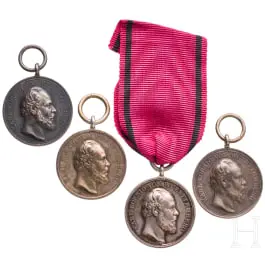 Quatre médailles civiles en argent du roi Karl