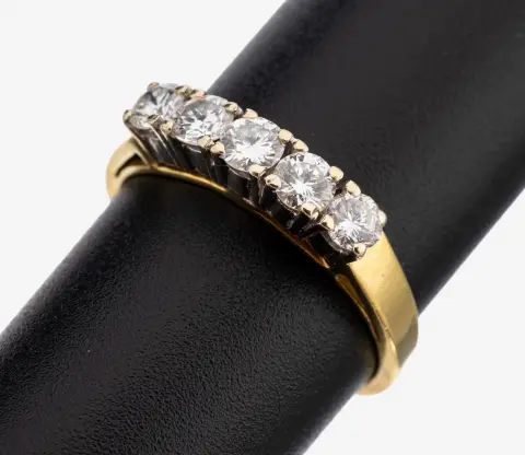 Bague brillant en or 18 kt, or jaune/blanc 750/000, 5 brillants total env. 0,65 ct (grav.)
