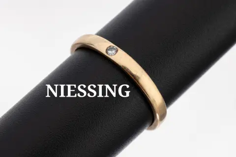 Bague diamantée NIESSING en or 14 kt, or gris 585/000, diamant env. 0,03 ct cert. blanc/p, sec.,