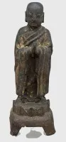 中国明代（1368-1644）佛教僧侣（如阿难或大迦叶）铜像，残留金漆。有年代痕迹，高29厘米