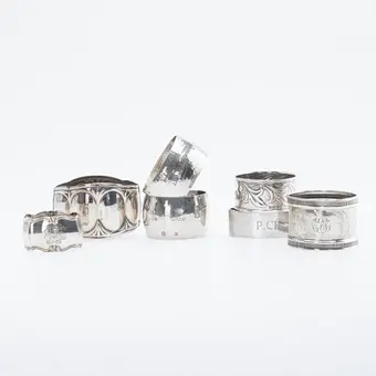 Colección de siete servilleteros distintos, plata, Alemania, Inglaterra, Italia, Dinamarca, siglo XX (7).