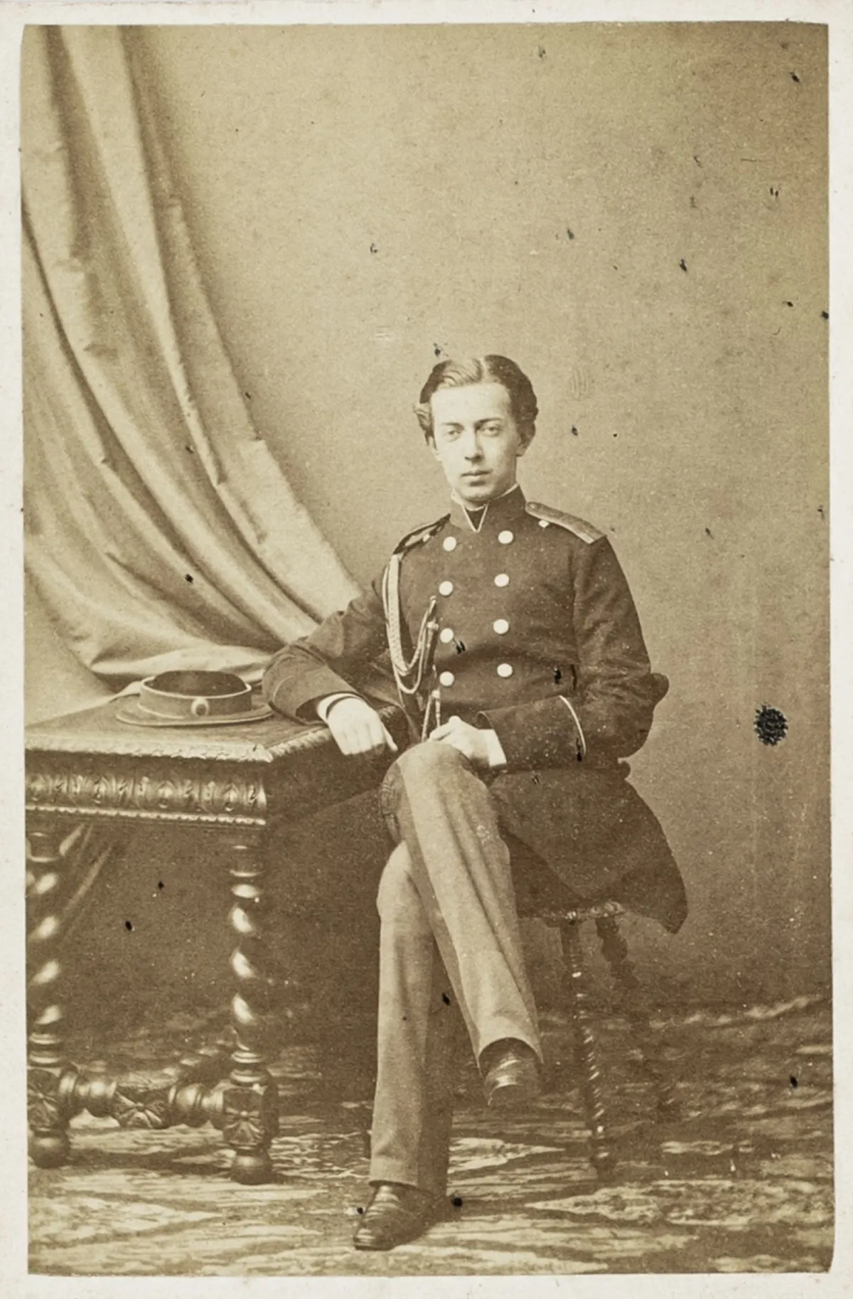Romanov Dynasty – Tsarevich Nikolaj Aleksandrovich (never crowned) in uniform (carte de visite, full figure seated)
