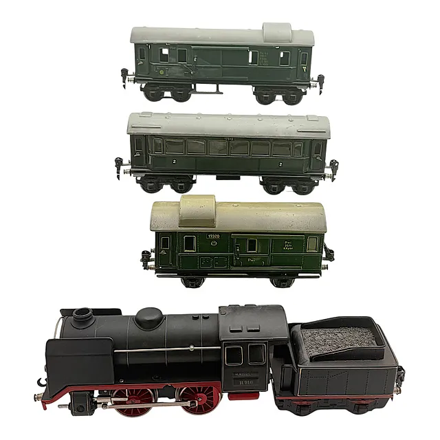 Locomotora de vapor Märklin R 910 con ténder, coche de pasajeros y dos furgones, escala 0, años 1930