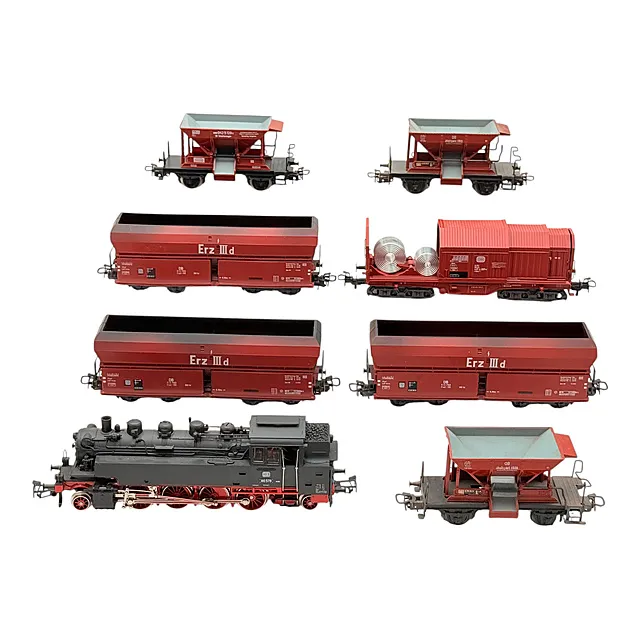 قاطرة بخارية مع خزان Märklin H0 3096 BR 86 لشركة DB مع سبع عربات شحن، على الأرجح ثمانينيات القرن العشرين