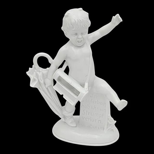 Sitzendorf porcelænsfigur med bånd med påskriften "I Lauterbach mistede jeg min strømpe"