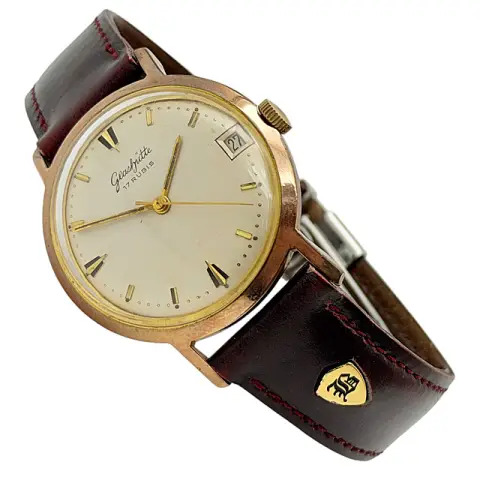 Glashütte GUB herenpolshorloge met handopwinding en datum, verguld 20 micron, rode leren band, circa 1965