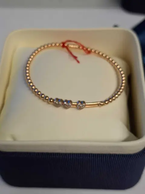 1 armbånd *** 18 karat rosaguld *** "Carl Bucherer"