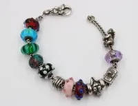 Trollbeads-armbånd, 925 sølv, 11 div. charms, til sammen ca. 45 g, lengde ca. 18 cm