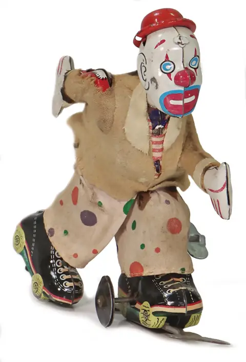 Clown en patins à roulettes