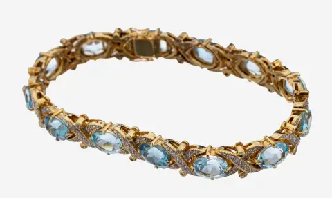 Bracelet topaze-diamant 14 kt or, or 585/000 poinçonné, 13 topazes bleues ovales (trait.)