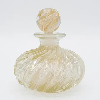 ARCHIMEDE SEGUSO。香水瓶，穆拉诺玻璃，公司BAROVIER & TOSO来自穆拉诺，手工吹制，透明漩涡玻璃嵌入金颗粒，厚壁玻璃，1950年代。