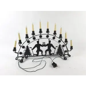 Vecchio candelabro in metallo ad arco