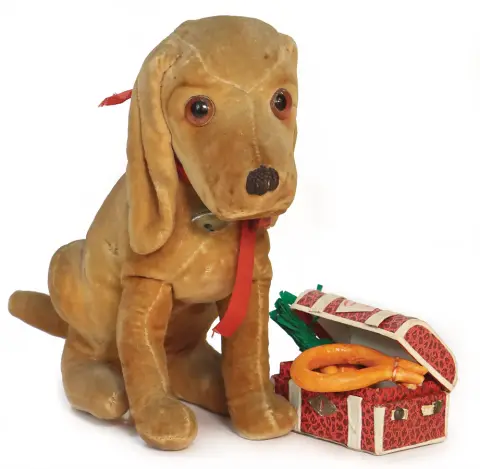 STEIFF – lieflijke zittende hond van fluweel