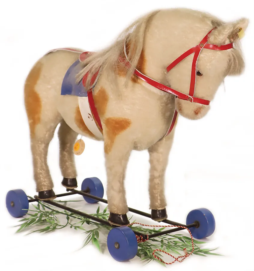 Steiff poney sur roues bleues