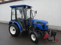 Foton 254 compact tractor with four-wheel drive, dozer blade and spreader