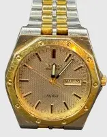 石英腕表 "Seiko" SQ100，星期和日期，钢/金色，机芯运转，保存良好，原装表带
