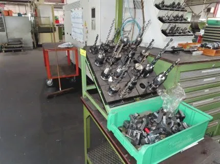 22 tool holders, some equipped with tools in the tool holder