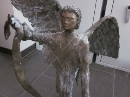 1 sculpture by Heide Kindelmann, on rectangular base plate, colour: mainly dark grey to grey-brown and in places silvery-metallic