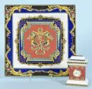 Table clock and dish "Rosenthal" – Porcelain, quartz clock with decor "Medusa" H= 8.5 cm, dish with decor "Le Roi Soleil" 3 x 22 x 22 cm, design Gianni…