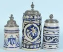 Beer mugs, 3 pieces – stoneware, various blue-glazed decors, pewter lids, H= 20-27 cm, around 1900, cylindrical mug with small hairline cracks on the rim
