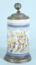 Chope cylindrique – faïence, glaçure beige, peinte à la main avec vue de village, monture de base et couvercle en étain, H= 26 cm, 18e s., restaurée,…