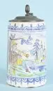 Chope cylindrique – Faïence, glaçure beige, peinte à la main avec joueur de flûte dans un paysage et décor floral, couvercle en étain, 19e s., base avec...