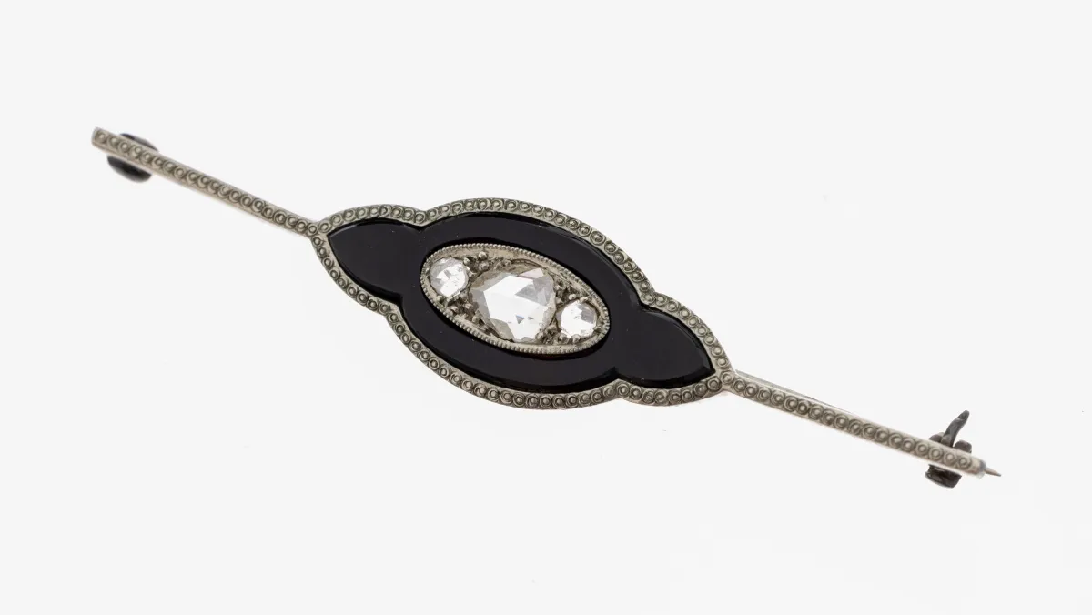 Art Deco platinum onyx diamond brooch, 1930s, platinum hallmarked, center section with onyx