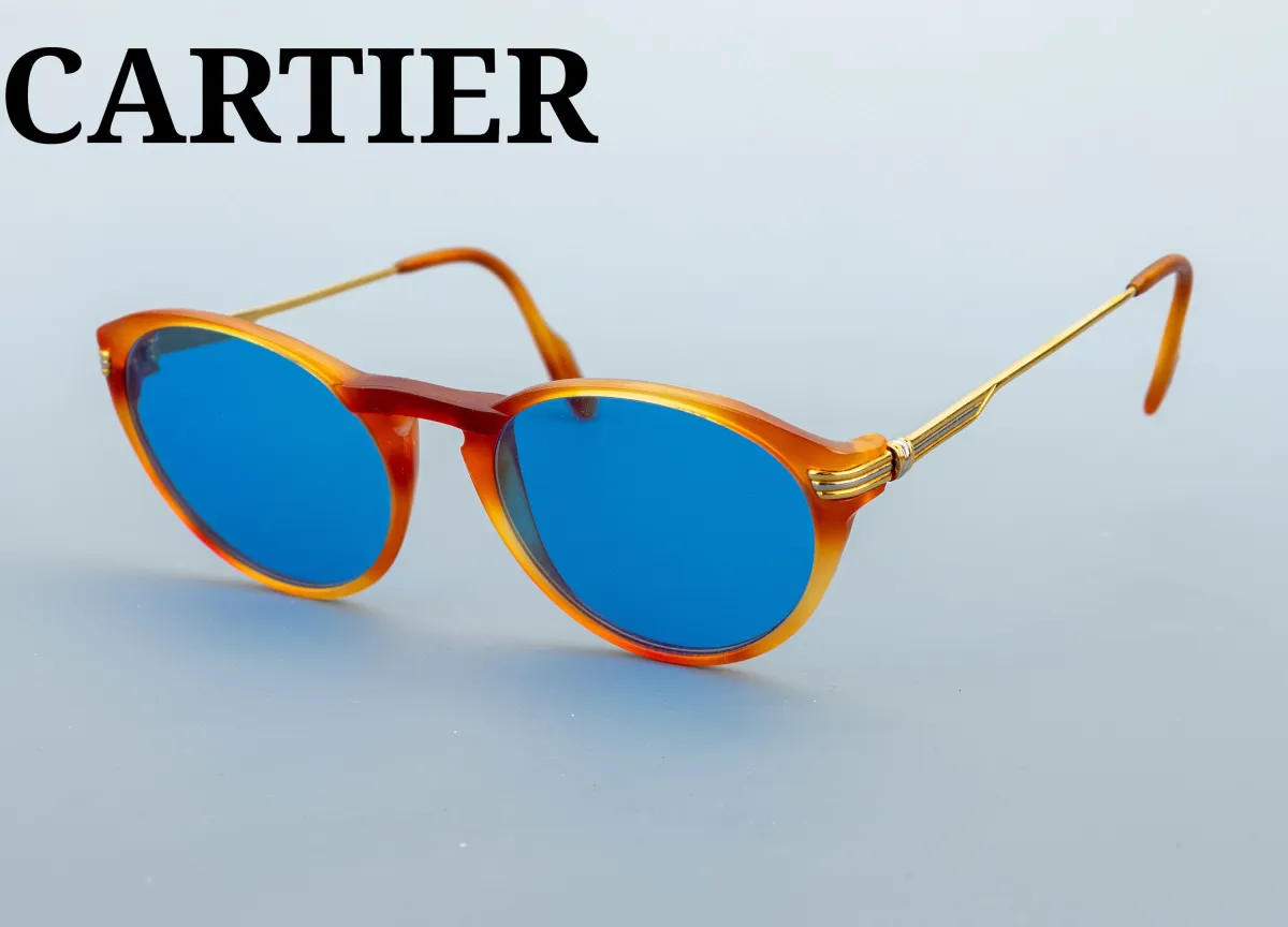 CARTIER Sonnenbrille, Metall verg., bernsteinfarb. Gestell, blau getönte Gläser,