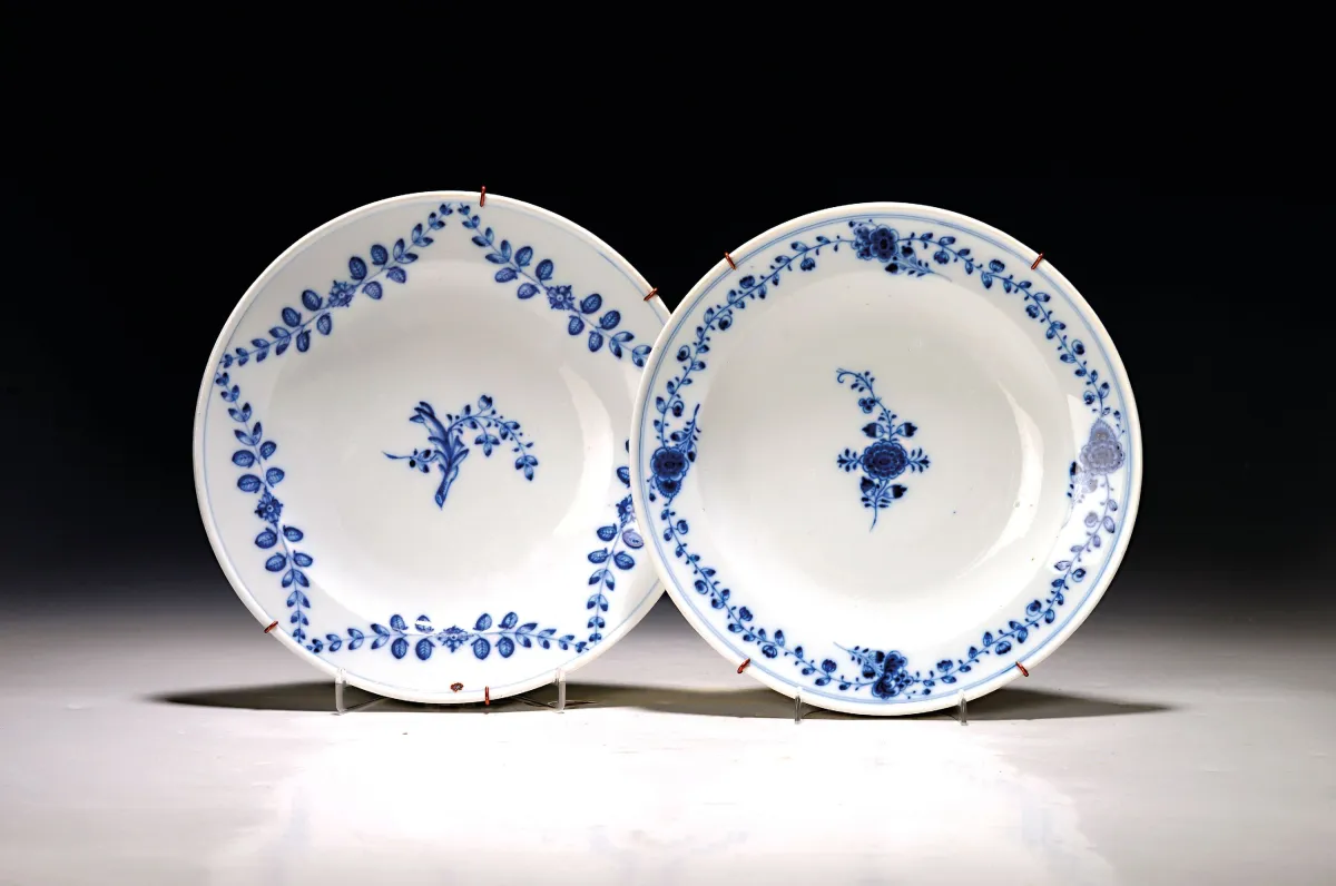 2 plates, Meissen, Marcolini, circa 1774-1814, painted with various blue tendrils under the